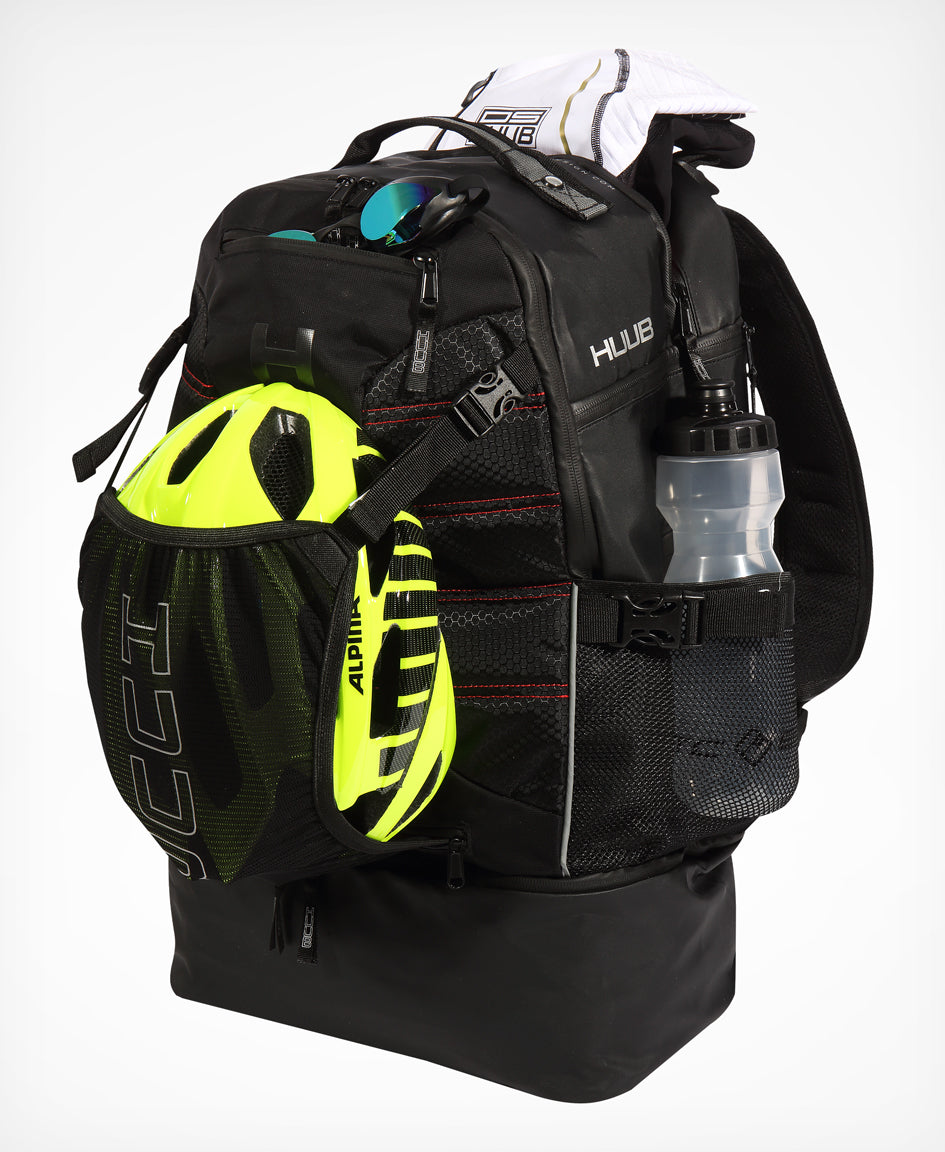HUUB TT Bag – Transition Three, 40L rucksack, wet/dry, hidden helmet cradle, navy and olive/orange.
