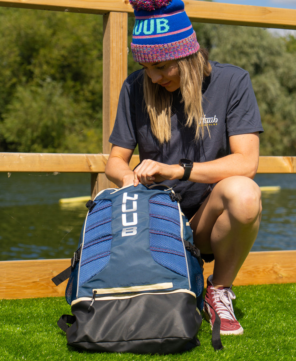 HUUB TT Bag – Transition Three, 40L rucksack, wet/dry, hidden helmet cradle, navy and olive/orange.