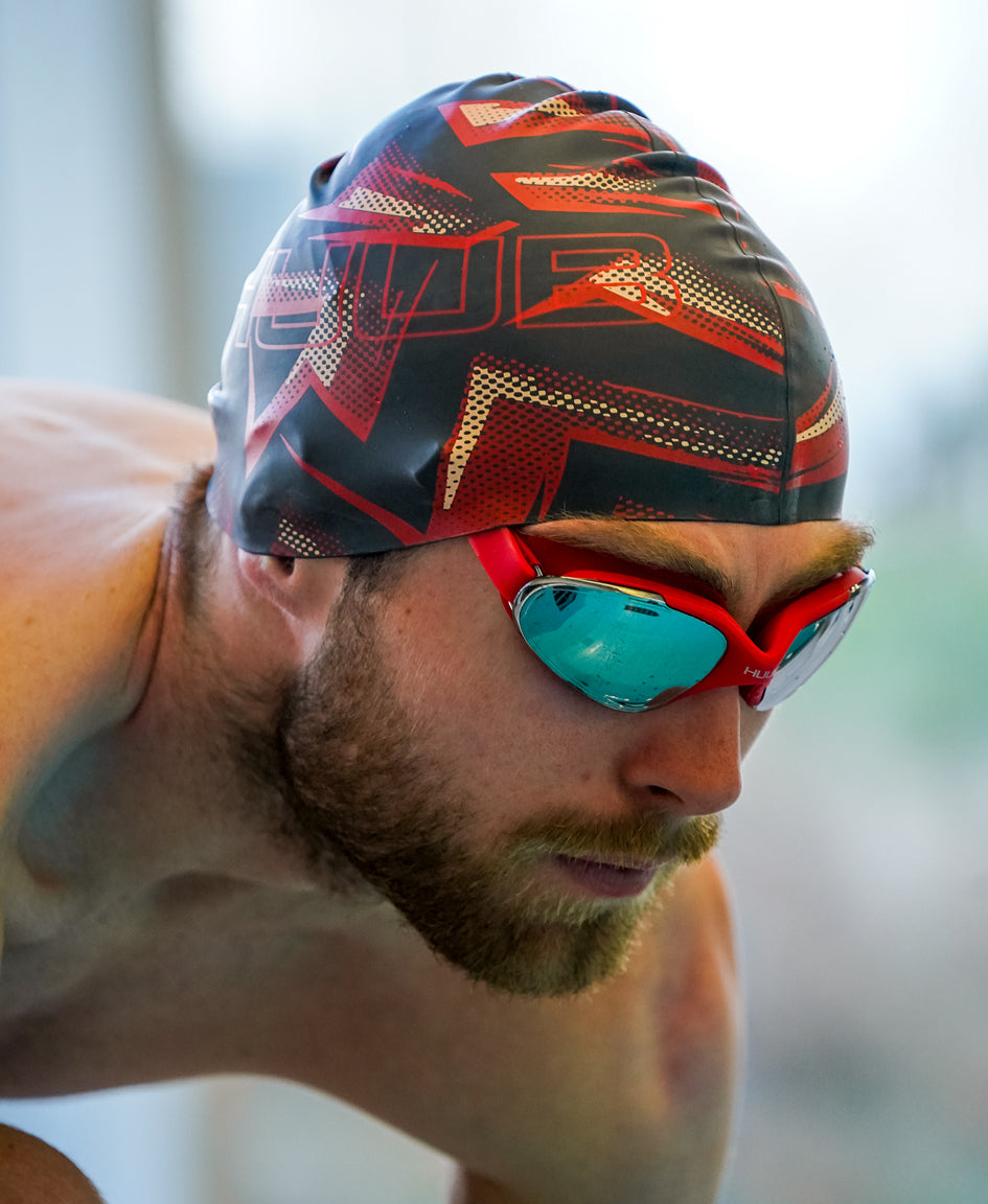 HUUB Silicone Strike Swim Cap – flat silicone, wrinkle-free, lightweight, marine-inspired color choices.